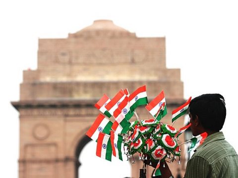 child at india gate with flags